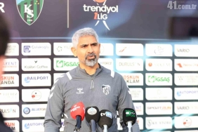 a man standing in front of microphones