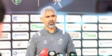 a man standing in front of microphones