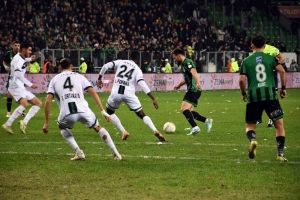 a group of men playing football