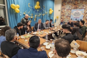 a group of people sitting around a table