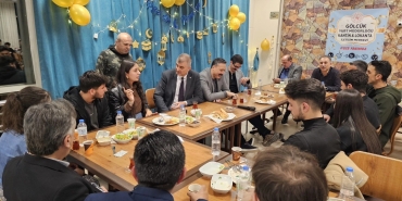 a group of people sitting around a table